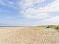 A wide empty beach under a summer sky at Caister-on-Sea, Norfolk