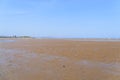 The wide expanse of Llanbedrog beach in Wales at low tide on a summer day