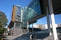 Urban outdoor grand staircase under modern glass facade architecture of University of Sydney Law School, Australia