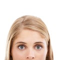 Wide-eyed wonder. Cropped studio shot of a young blonde woman isolated on white. Royalty Free Stock Photo