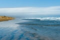 Wide flat sand between dunes and sea at Ninety Mile beach