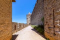 Wide fortified walls with walkways and arches of medieval castle of Carcassonne town Royalty Free Stock Photo