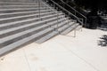 Wide gray concrete stairs in an outdoor urban street landscape, metal railing, creative copy space Royalty Free Stock Photo