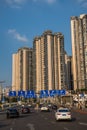 Highway leading to high residential blocks in Chongqing city suburb