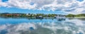 Green Bay of St John`s, Antigua and Barbuda. Panoramic view of the harbour bay and reflection of the clouds in the water. Royalty Free Stock Photo