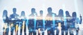 Wide image of businesspeople silhouettes standing on abstract night city background with forex chart. Teamwork, trade and