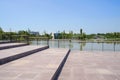 Wide lakeside fenced stairway in city of sunny summer afternoon