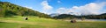 Wide landscape panorama lake gerold and pasture with huts, view to karwendel mountains Royalty Free Stock Photo