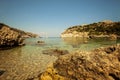 A wide lens landscape view at the beach in Anthony Quinn bays clear waters in Rhodes, Greece