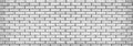 Wide light gray brick wall texture. Whitewashed panoramic background Royalty Free Stock Photo