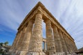Wide Low-Angle View of the Doric Temple of Segesta Against a Dramatic Blue Sky with White Clouds, Sicily Royalty Free Stock Photo