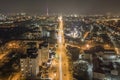 Wide night panorama, aerial top view of modern city. Scene of bright lights of tall buildings, illuminated streets, high Royalty Free Stock Photo