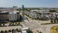 Wide open aerial view mixed of multistory office buildings, apartment towers and luxury villa residential houses along