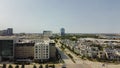 Wide open aerial view mixed of multistory office buildings, corporate offices and luxury villa residential houses along