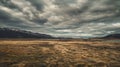 Wide Open Field With Mountains in the Background Royalty Free Stock Photo