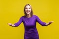Wide open hug. Nice to meet you! Portrait of generous woman standing with wide raised arms and welcoming or sharing smth. isolated Royalty Free Stock Photo