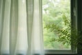 a wide open window with sheer curtains rustling in the breeze Royalty Free Stock Photo