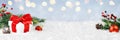 Wide panorama banner design image with festive Christmas decoration ornaments in winter landscape with gift box and decorations Royalty Free Stock Photo