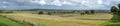 Wide panorama of beautiful Cotswold landscape on a sunny autumn day with a long vista. English countryside Royalty Free Stock Photo