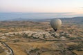 Wide panorama of Cappadocia landscape - colored balloons flying over mountain peaks and fantastic valley. Air balloons above Royalty Free Stock Photo