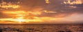 Panorama of golden sunset over ocean. Royalty Free Stock Photo