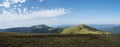 Wide panorama of grassy green hills and slopes at ridge of Low Tatras mountains with hiking trail footpath, mountain Royalty Free Stock Photo
