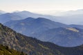 Wide panorama of green mountain hills in sunny clear weather. Carpathian mountains landscape in summer. View of rocky peaks covere Royalty Free Stock Photo