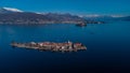 Wide panorama of Isola Superiore on lago Maggiora in italy on a beautiful sunny winter day. Majestic mountains with snow visible