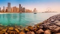 Wide panorama of Persian Gulf with famous Ferris wheel Dubai Eye and numerous skyscrapers with hotels and residences. Travel