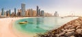 Wide panorama of Persian Gulf with sandy beach and Bluewaters Island with the worlds famous largest Ferris wheel Dubai Eye and