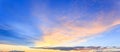 Wide panorama of sunset sky with clouds and sunlight over the sea for your idea of web header Royalty Free Stock Photo