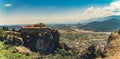 Wide panoramic drone view of one of many Meteora Monasteries placed on the top of rock formations. Summer holidays in Royalty Free Stock Photo