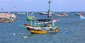 Beautiful picture of fishing boats at Jimbaran Bay at Bali Indonesia, beach, ocean, fishing boats and airport in photo. Royalty Free Stock Photo