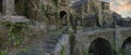 Wide panoramic view of a beautiful fantasy medieval castle with steps leading to a stone bridge. 3D illustration