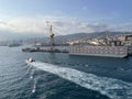 wide panoramic view of the harbor of Genoa. Blue sky blue sea white clouds and port buildings in harmony with the