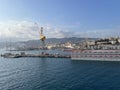 wide panoramic view of the harbor of Genoa. Blue sky blue sea white clouds and port buildings in harmony with the Royalty Free Stock Photo