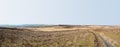 Wide panoramic view of midgley and wadworth moors in calderdale west yorkshire with a pathway leading downhill to old town and