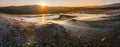 Wide panoramic view of Mud volcanoes with stunning sunrise in Chahuna managed reserve in Georgia