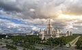 Wide panoramic view of spring campus of famous Russian university in Moscow under dramatic sky with sun beams Royalty Free Stock Photo
