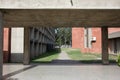 Wide passage under concrete ceiling with terrazzo floor