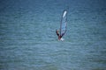 Wide photo of professional wind surfer practice on the sea wave with deep blue open turquoise sea. Azov, Russia - July 25.2021 Royalty Free Stock Photo