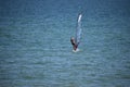 Wide photo of professional wind surfer practice on the sea wave with deep blue open turquoise sea. Azov sea, July 25.2021 Royalty Free Stock Photo