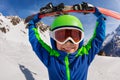 Wide portrait of a boy with ski on shoulders Royalty Free Stock Photo