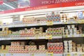 Wide range of processed cheese on shelves of supermarket. Choice of milky goods