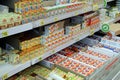 Wide range of processed cheese on shelves of supermarket. Choice of milky goods