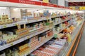 Wide range of processed cheese on shelves of supermarket. Choice of milky goods