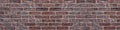 Wide red brick wall texture. Orange brickwork panoramic background Royalty Free Stock Photo