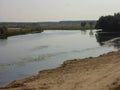 A wide river with a wide floodplain on a late Sunny summer morning Royalty Free Stock Photo