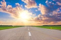 Wide runway view of the sun in the sky above the beautiful horizon, concept, future success beginnings Royalty Free Stock Photo