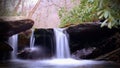 Wide Screen Photo of Waterfall in the Woods Slow Shutter Speed Motion Blurred Royalty Free Stock Photo